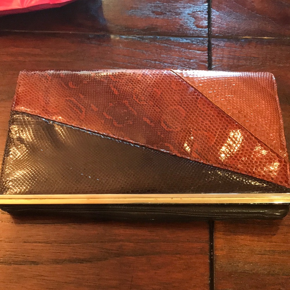 Snakeskin clutch measure approx 12 in by 7in
